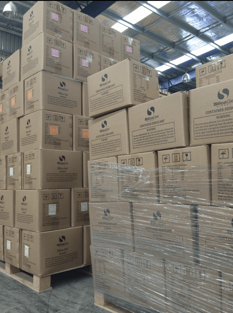 Packed export cartons and wrapped pallets in storage
